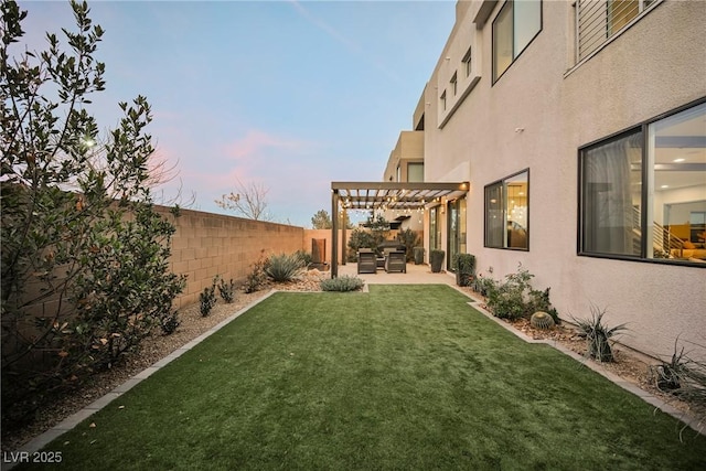 yard at dusk featuring an outdoor living space, a pergola, and a patio