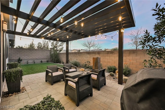 patio terrace at dusk featuring a grill, an outdoor hangout area, and a pergola