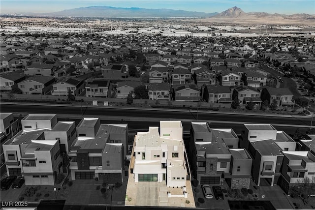 birds eye view of property featuring a mountain view