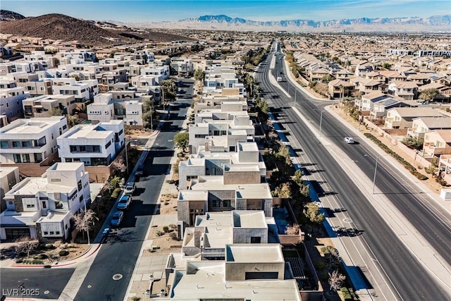 birds eye view of property featuring a mountain view