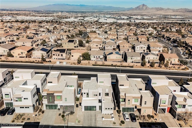 birds eye view of property featuring a mountain view