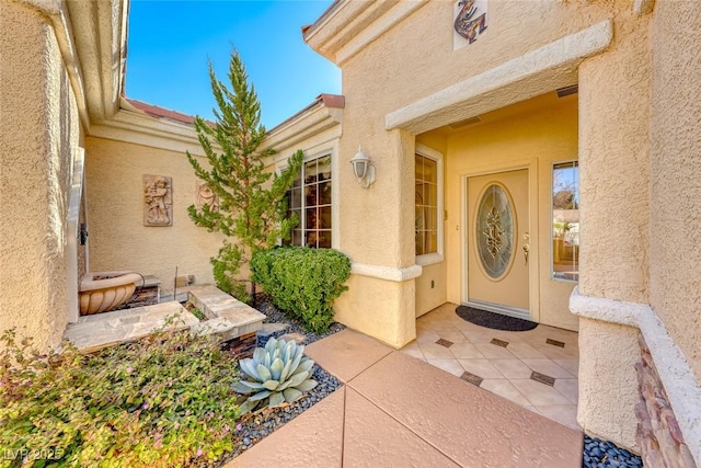 entrance to property with a patio area