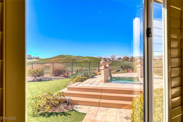 exterior space with a patio and a mountain view