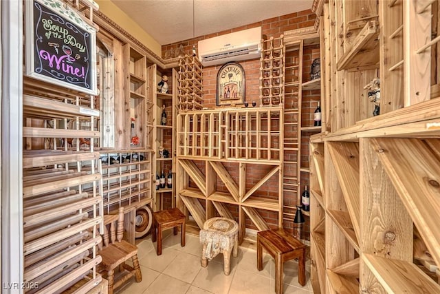 wine cellar featuring an AC wall unit, tile patterned floors, and a textured ceiling