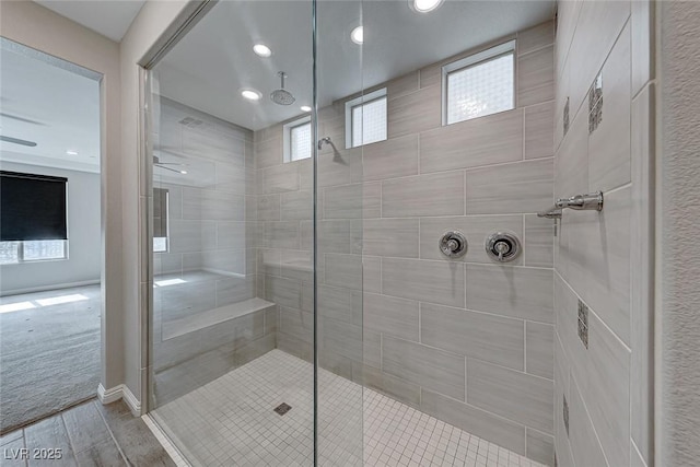 bathroom with a tile shower