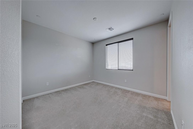 empty room featuring light colored carpet