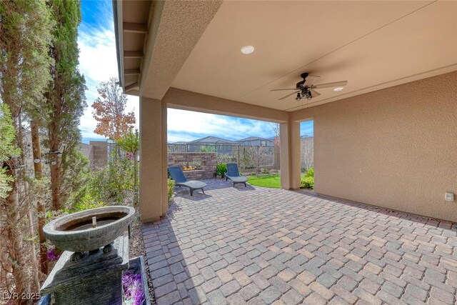 view of patio / terrace featuring ceiling fan