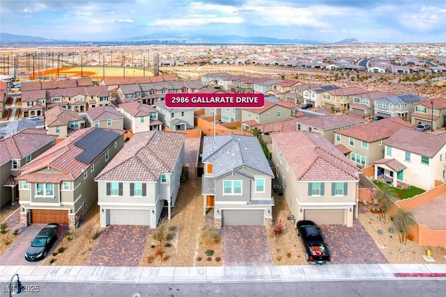 birds eye view of property featuring a mountain view