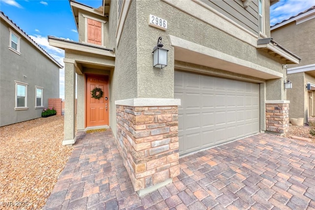 entrance to property featuring a garage