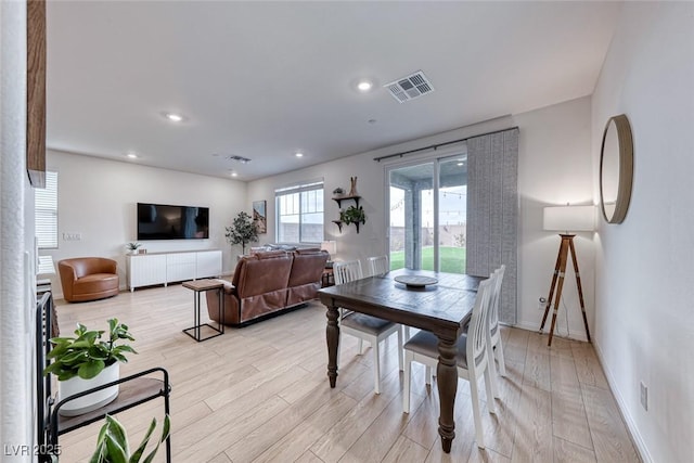 dining area with light hardwood / wood-style flooring