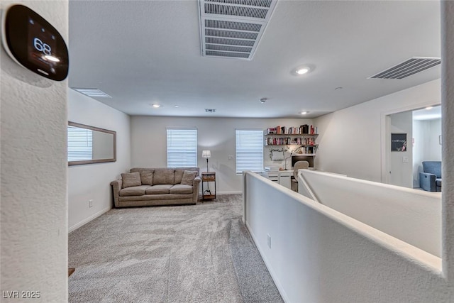 interior space featuring light colored carpet