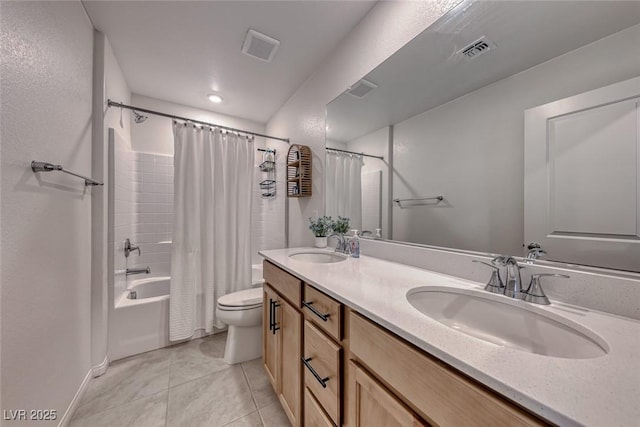 full bathroom with vanity, tile patterned flooring, toilet, and shower / bath combo