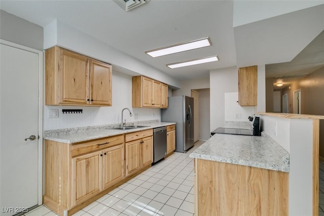 kitchen featuring stainless steel appliances, sink, light tile patterned floors, and light brown cabinets