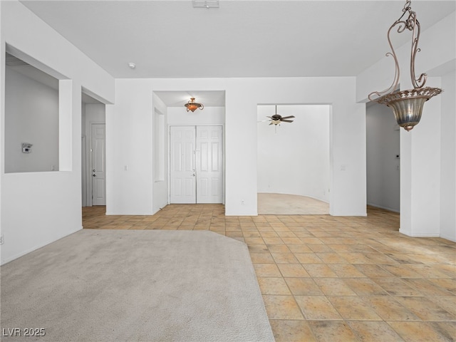 unfurnished room featuring ceiling fan