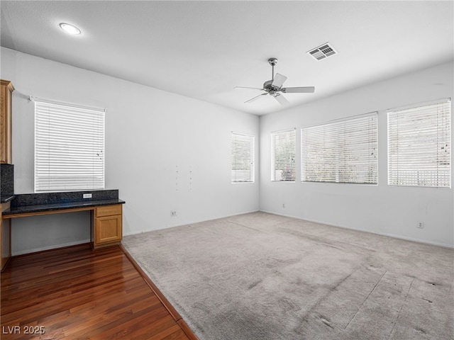 interior space featuring dark hardwood / wood-style floors and ceiling fan