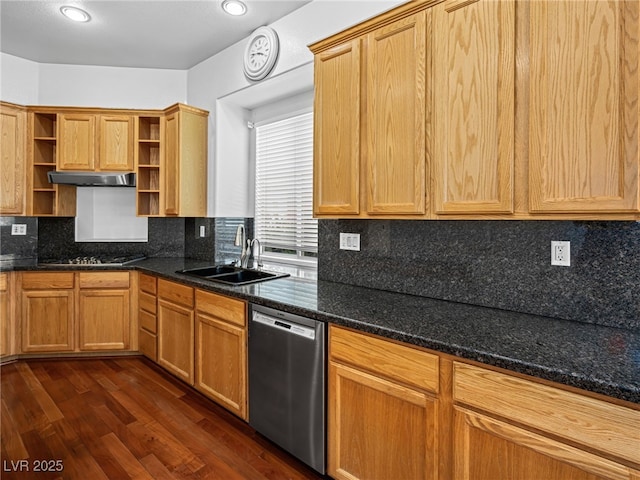 kitchen featuring sink, dark wood-type flooring, dark stone counters, and appliances with stainless steel finishes