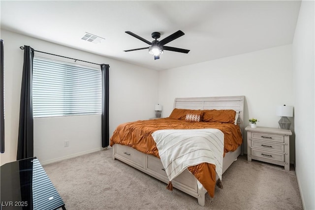 bedroom with light carpet and ceiling fan