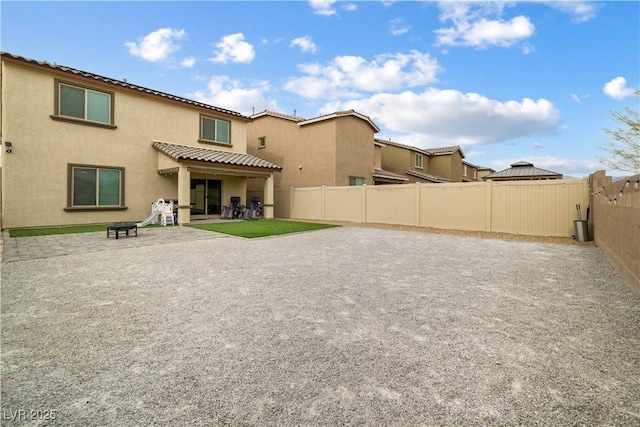 back of house featuring a patio