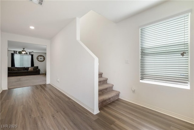 stairs with hardwood / wood-style floors