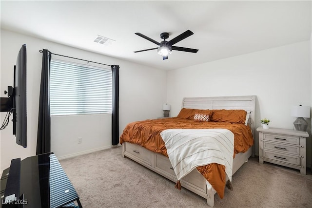 bedroom with light carpet and ceiling fan