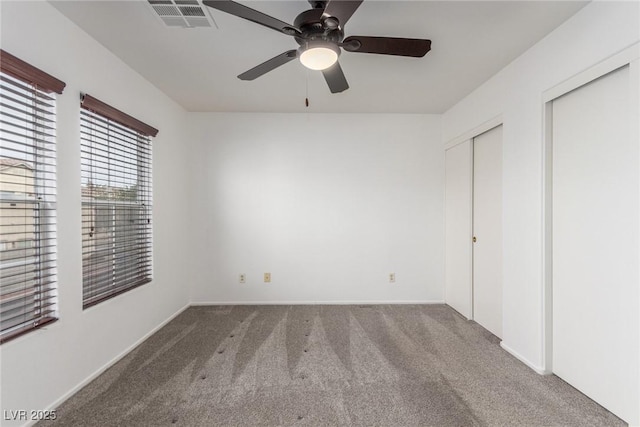 unfurnished bedroom with carpet floors and ceiling fan