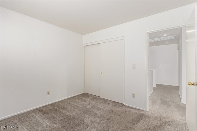 unfurnished bedroom with light colored carpet