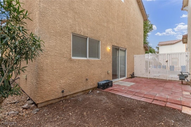 rear view of house with a patio