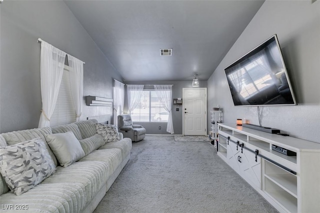 living room with light carpet and vaulted ceiling