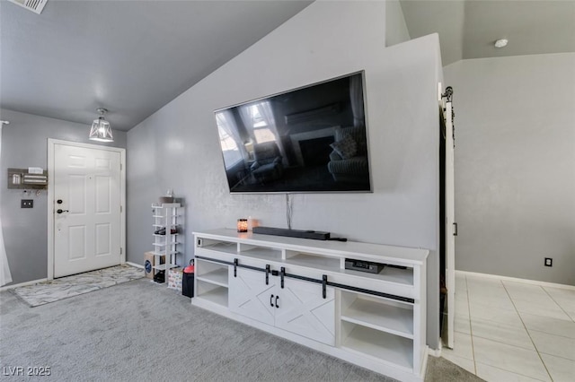 entrance foyer with vaulted ceiling and carpet