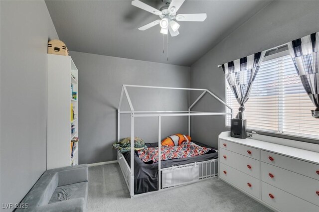 carpeted bedroom featuring ceiling fan and lofted ceiling