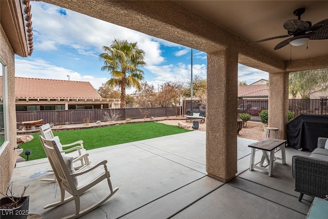 view of patio with ceiling fan and grilling area