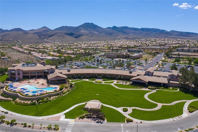 birds eye view of property featuring a mountain view