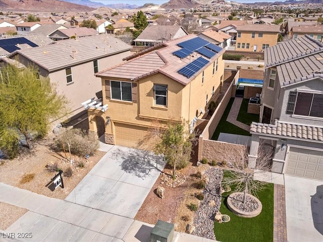 bird's eye view featuring a mountain view and a residential view