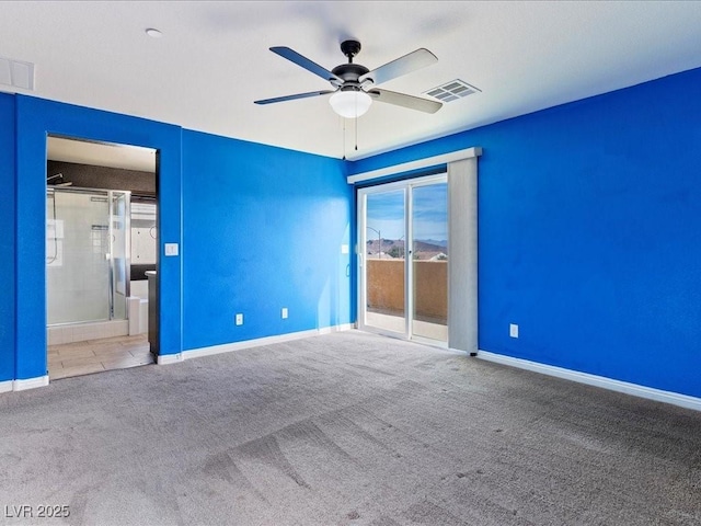 unfurnished bedroom featuring carpet, visible vents, access to outside, and baseboards