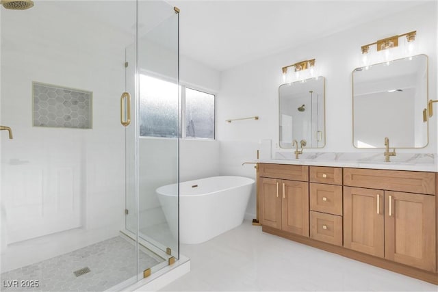 bathroom featuring shower with separate bathtub and vanity