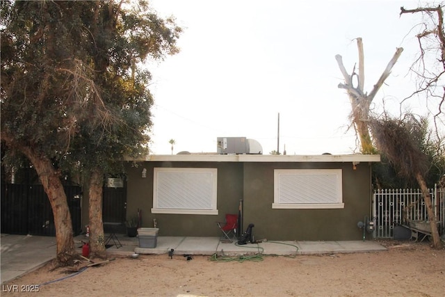 exterior space with a patio area and central air condition unit