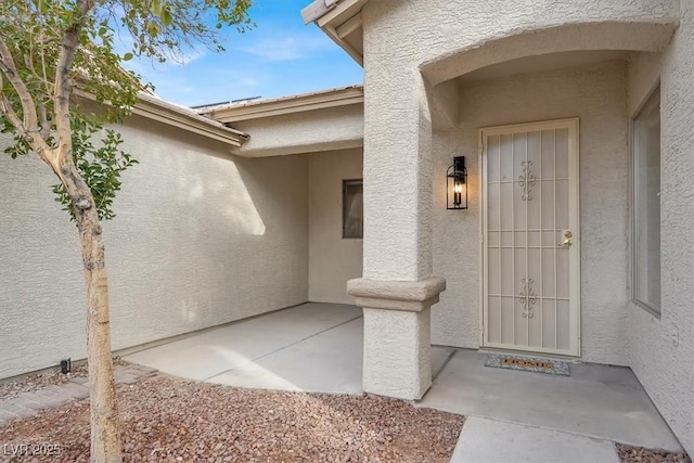 entrance to property with a patio area