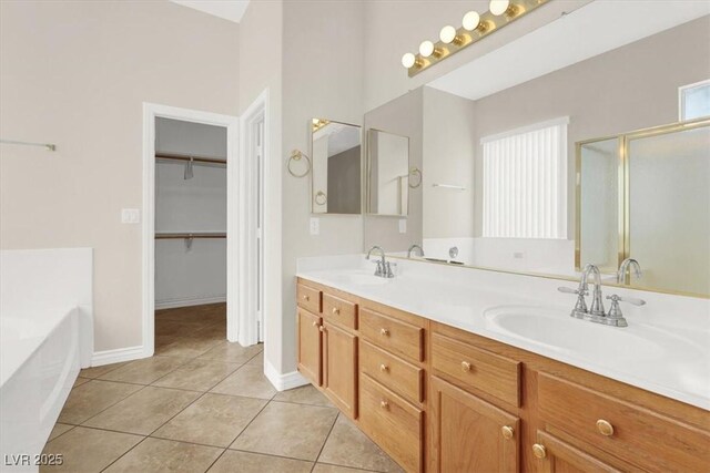 bathroom with vanity, tile patterned floors, and separate shower and tub