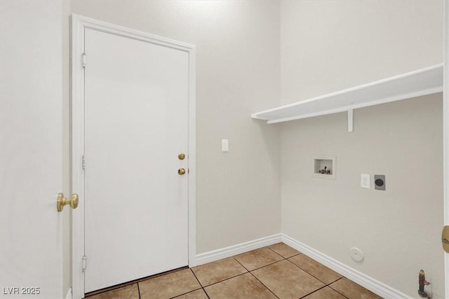 clothes washing area featuring light tile patterned floors, electric dryer hookup, gas dryer hookup, and hookup for a washing machine