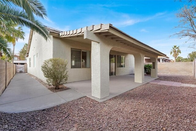 rear view of property featuring a patio