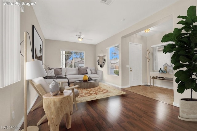 living room featuring hardwood / wood-style flooring and ceiling fan