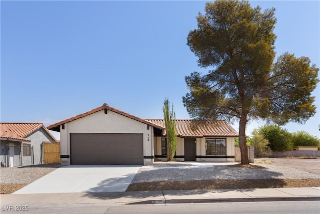 mediterranean / spanish house with a garage