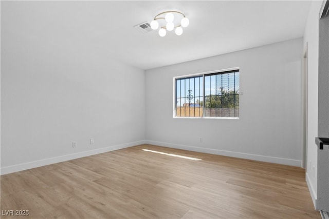 unfurnished room featuring light hardwood / wood-style floors