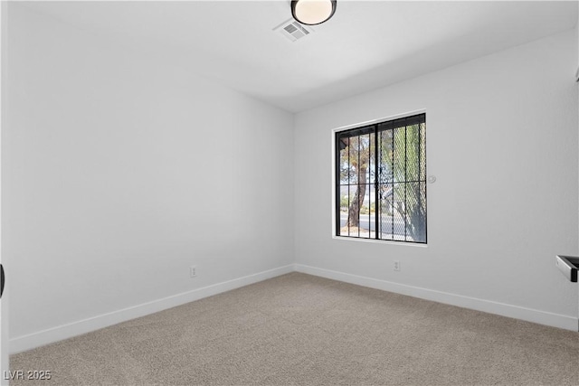 spare room featuring carpet flooring