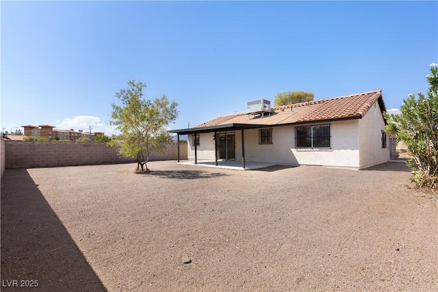 rear view of house with a patio area and central air condition unit