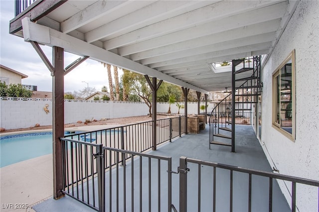 view of patio with a fenced in pool