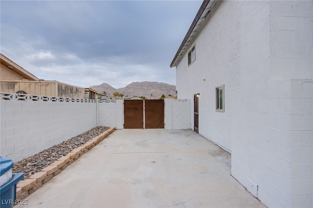 view of patio / terrace featuring a mountain view