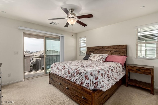 bedroom featuring access to exterior, light colored carpet, and ceiling fan