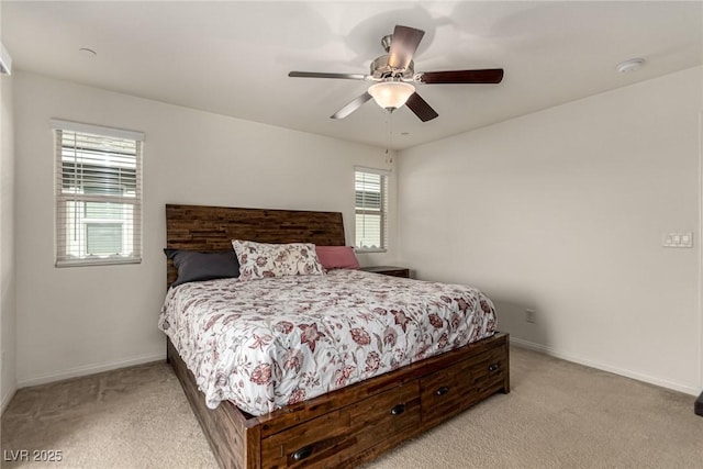 bedroom with light colored carpet and ceiling fan