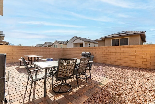 view of patio featuring a grill